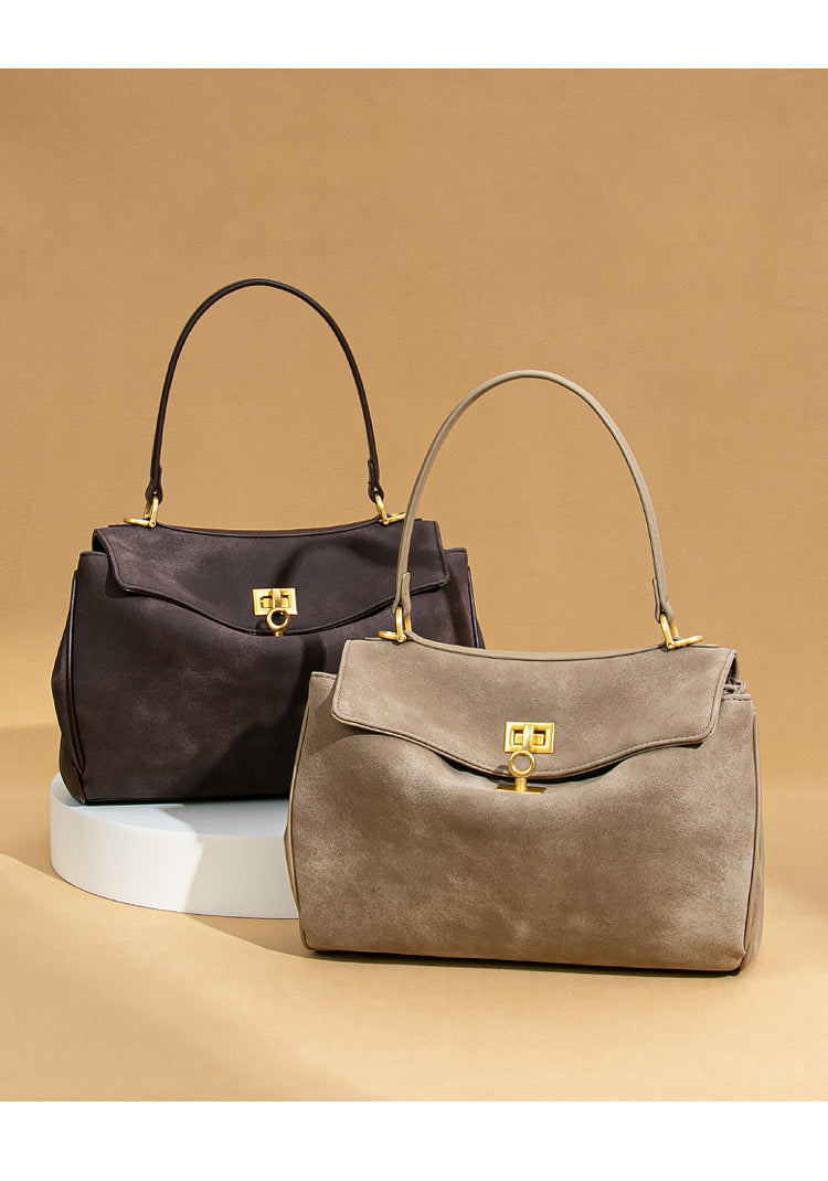 Two stylish suede handbags with gold clasps from Original Frosted Deerskin Bag fashion collection