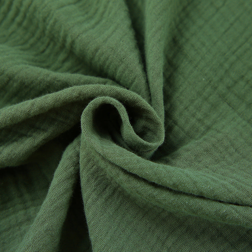 Wrinkled green fabric of Comfortable Skin Friendly winter pajamas demonstrating fashion and ملابس style