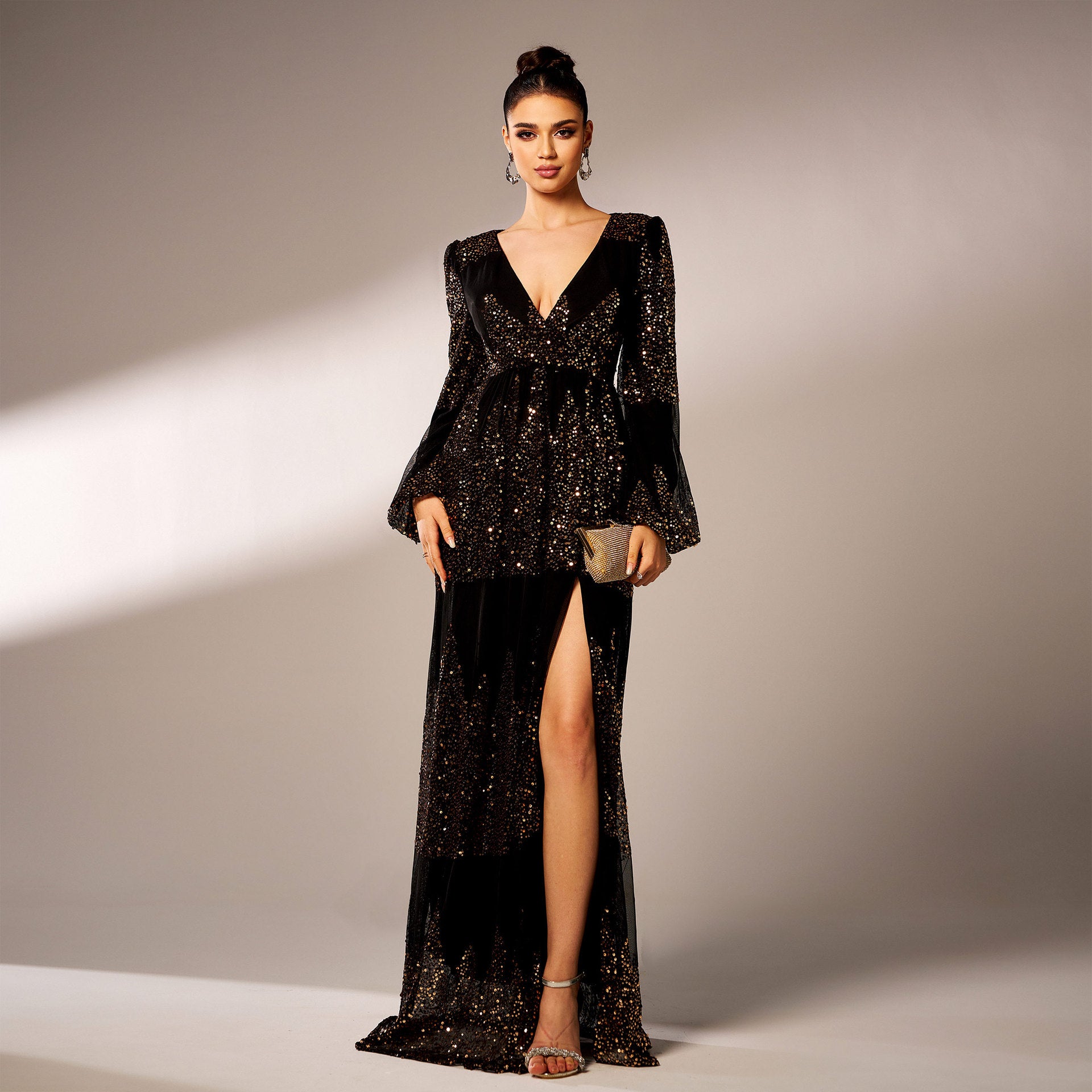 Elegant black sequined gown with thigh-high slit in high-end evening dress fashion