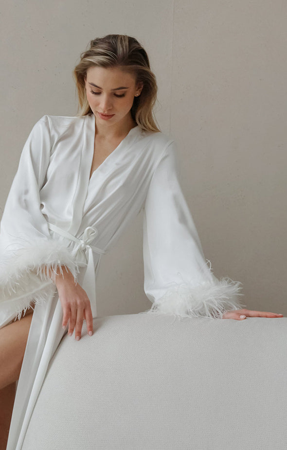 Elegant white feather-trimmed satin long sleeve robe in deep V-neck fashion