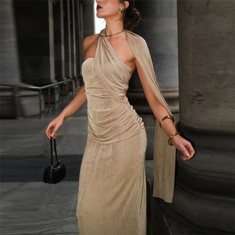 Beige one-shoulder draped maxi dress showcasing elegant fashion for evening occasions