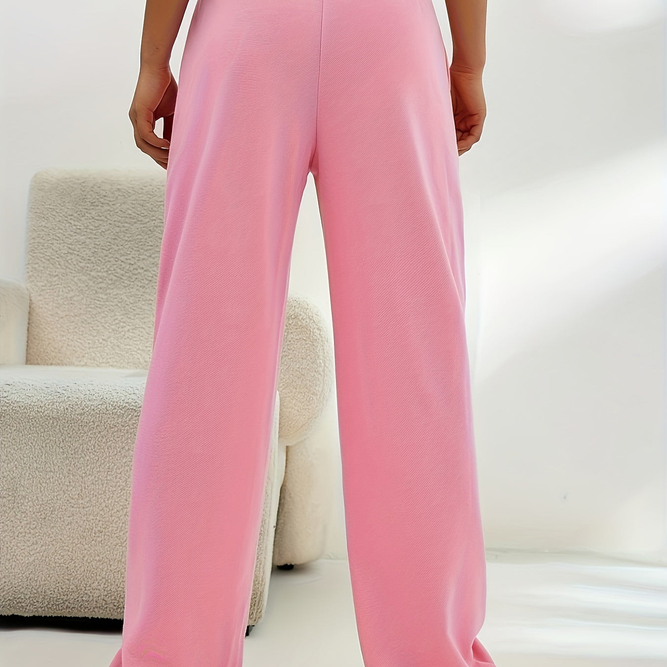 Pink wide-leg sweatpants with elastic waistband, ideal for casual fashion and comfort