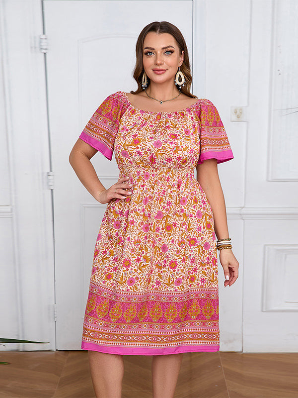 Elegant bohemian dress with floral pattern, off-the-shoulder style, and flutter sleeves