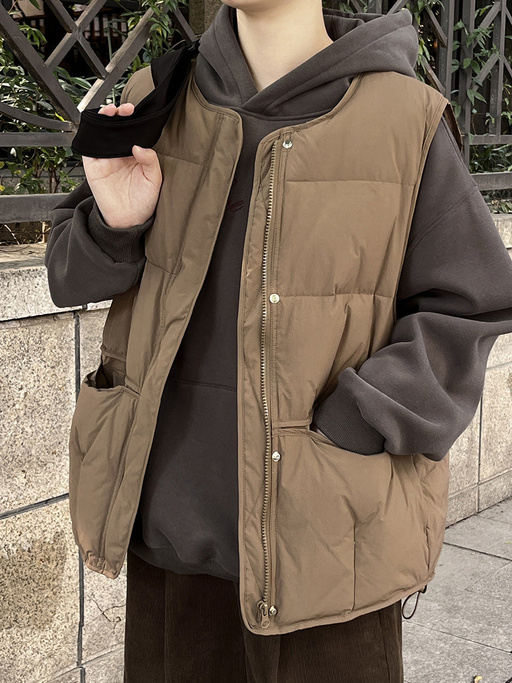 Brown puffy vest over dark gray sweatshirt in Langry Winter Korean fashion ملابس