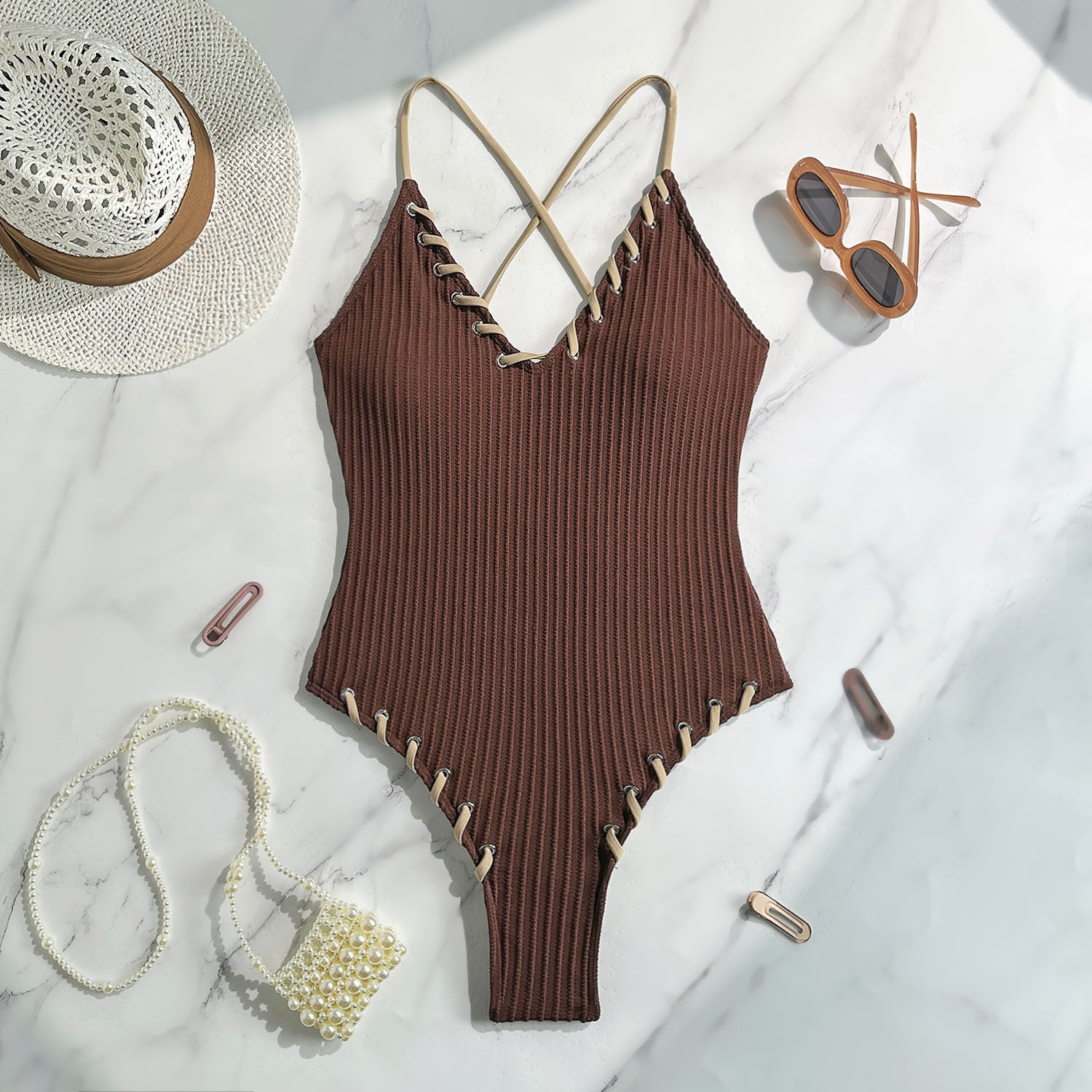 Brown ribbed one-piece swimsuit with white stitching and crisscross straps in Langry fashion