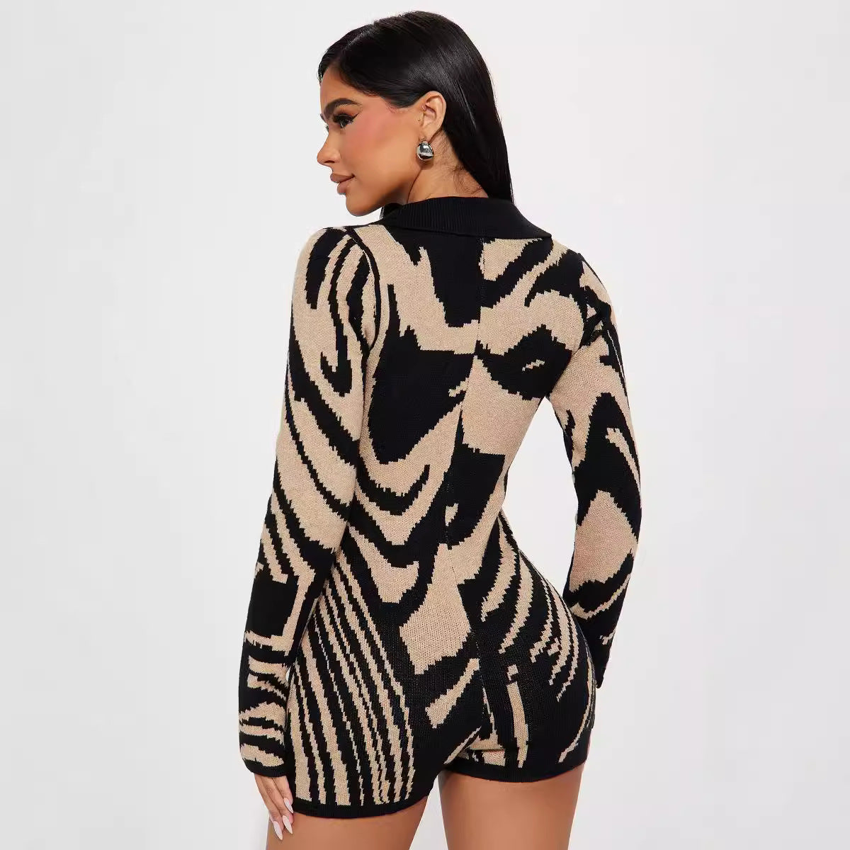 Zebra-patterned knit long sleeve romper, perfect for casual fashion enthusiasts