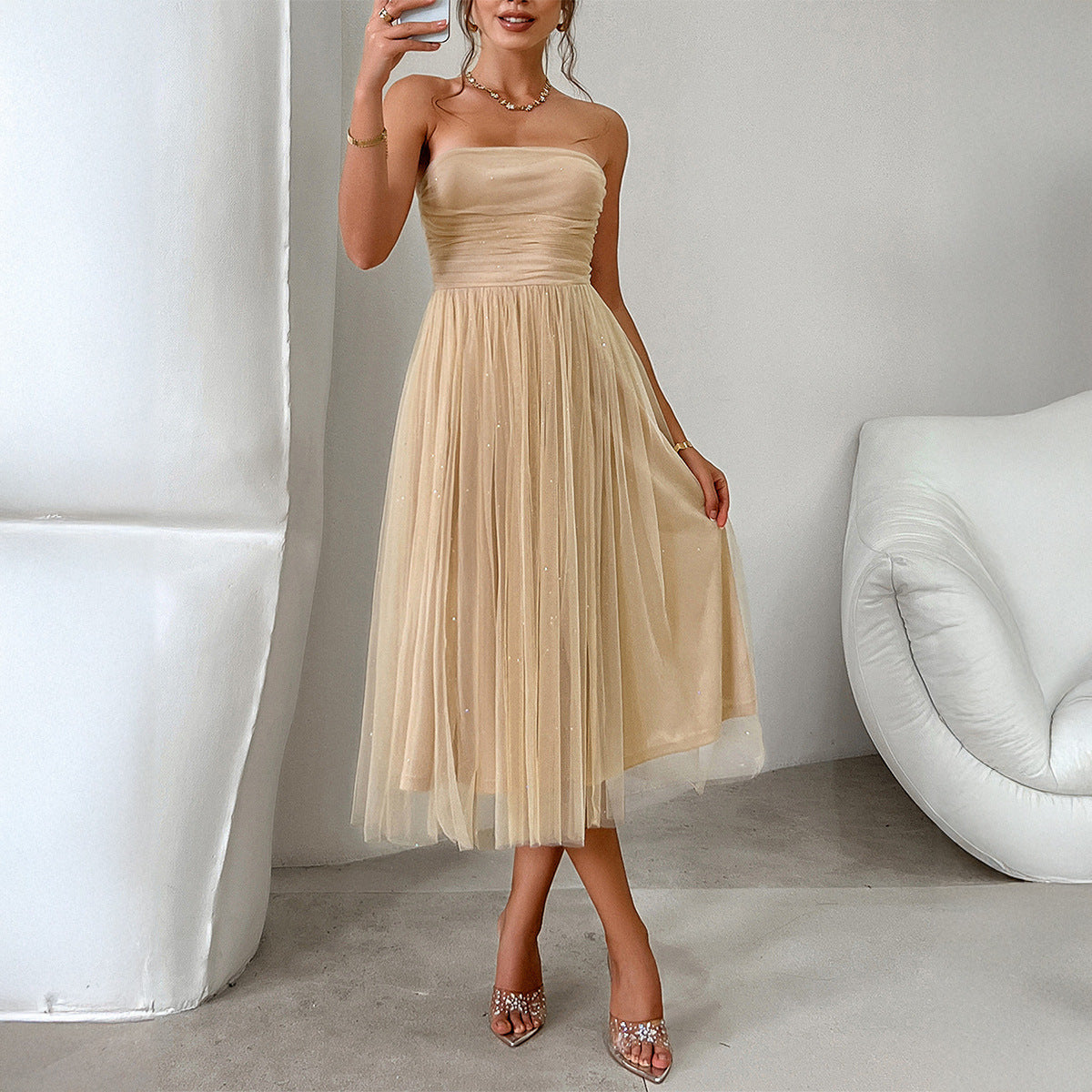 Strapless champagne tulle midi dress, fitted bodice, flowing skirt, elegant fashion ملابس