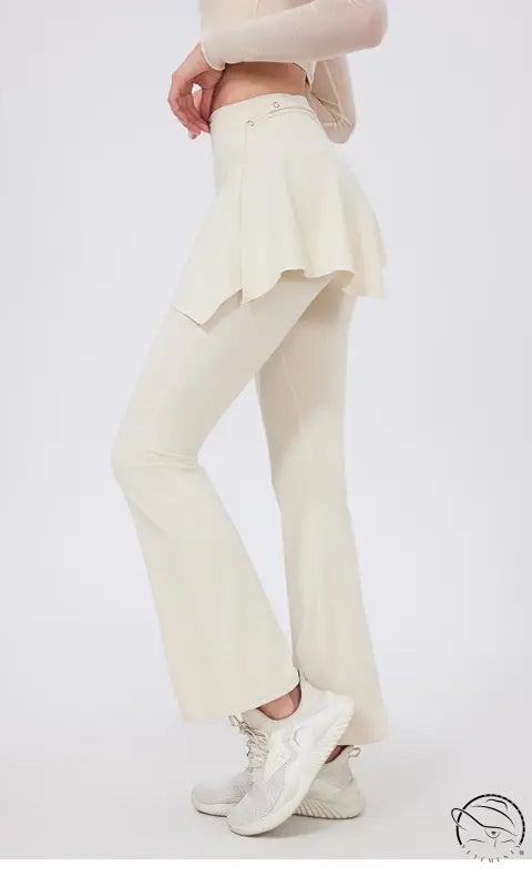 Cream-colored hip lifting yoga pants with nude feel and flared ruffled hem