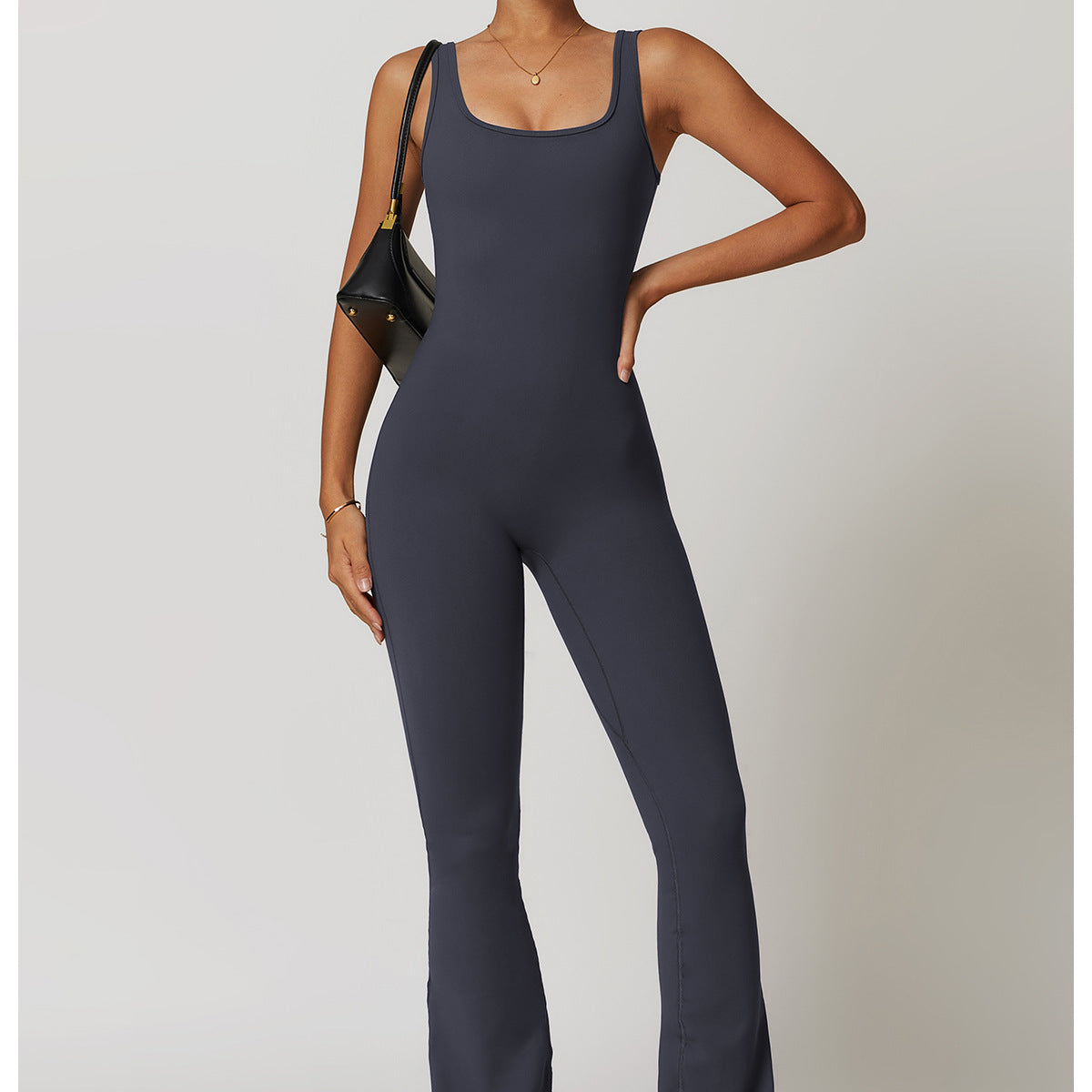Sleeveless charcoal gray fitted jumpsuit with flared legs for active fashion wear