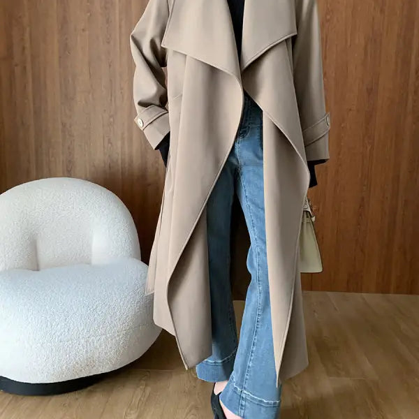 Tan trench coat with wide lapels in cozy langry fashion ملابس