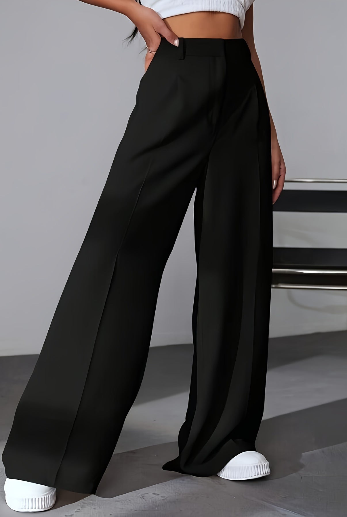 Black wide leg dress pants with front pleat, ideal for fashion-forward work attire