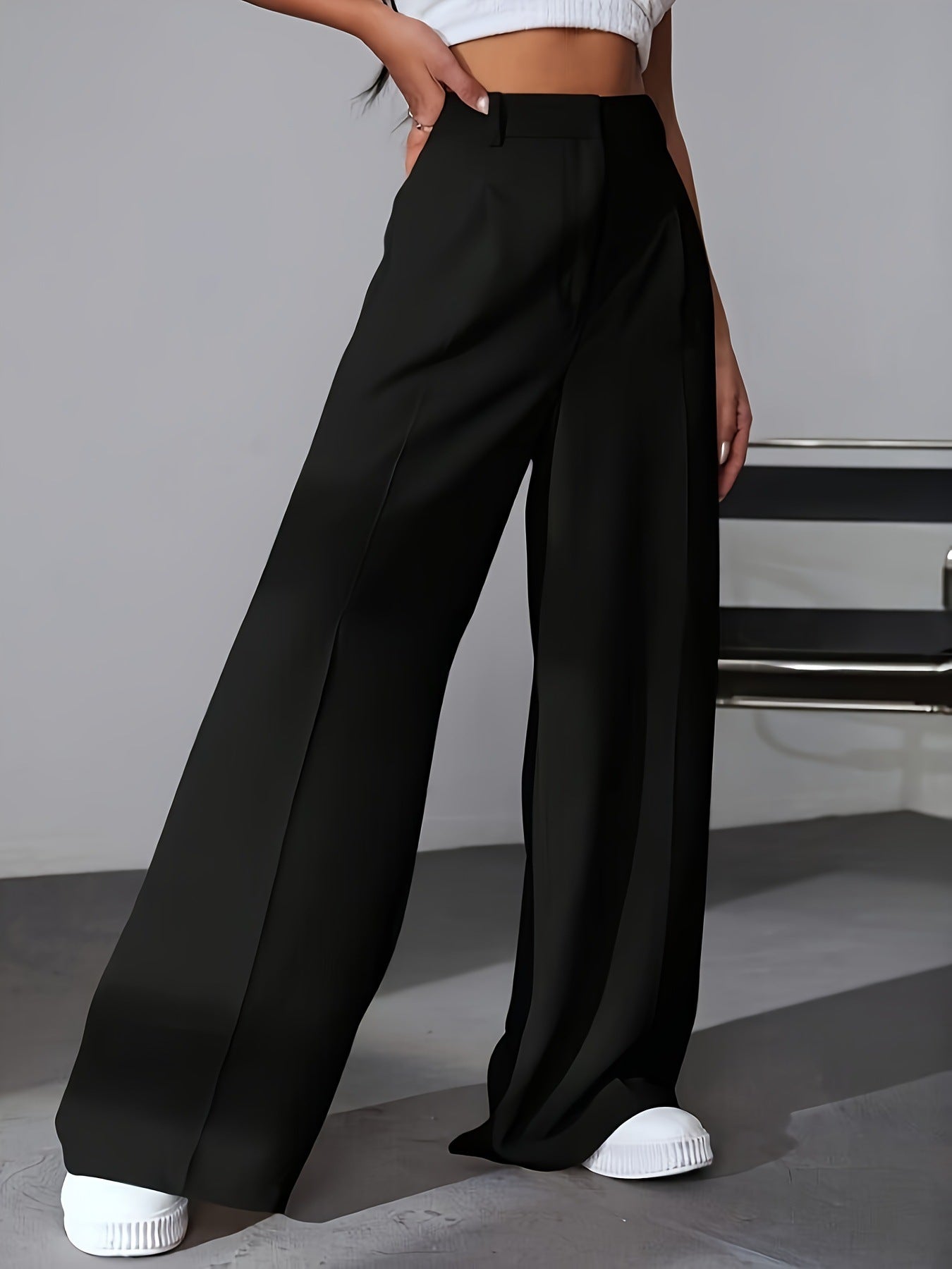 Black wide leg dress pants with front pleat, ideal for fashion-forward work attire