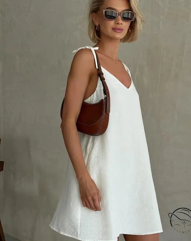 Woman in casual backless cotton home wear with short blonde hair