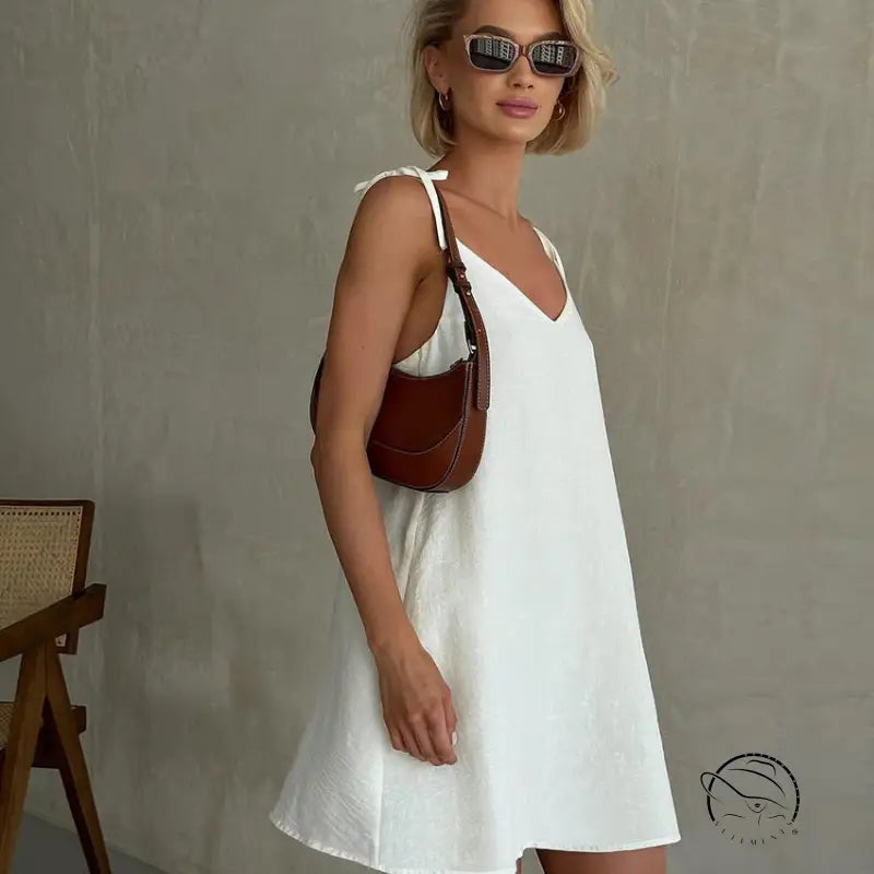 Woman in casual backless cotton home wear with short blonde hair