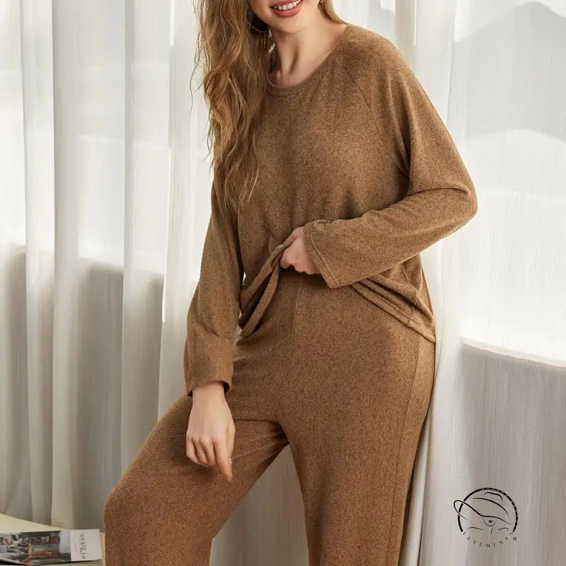 Woman in cozy winter long sleeves two piece set with ankle tied pants
