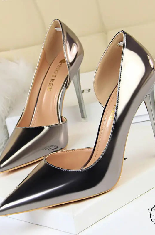 Simple stiletto heel metal pumps in silver and black metallic finish