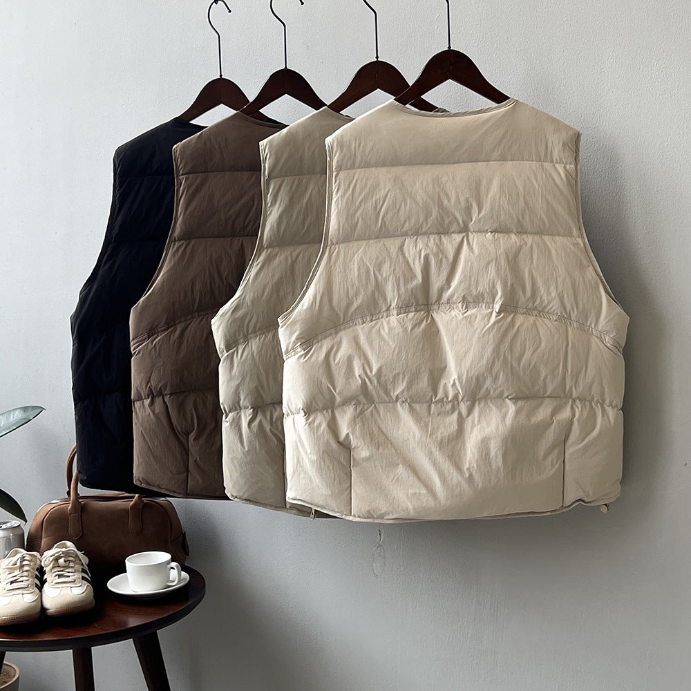 Four neutral-colored Winter Korean round Neck Warm Vests hanging on wooden hangers