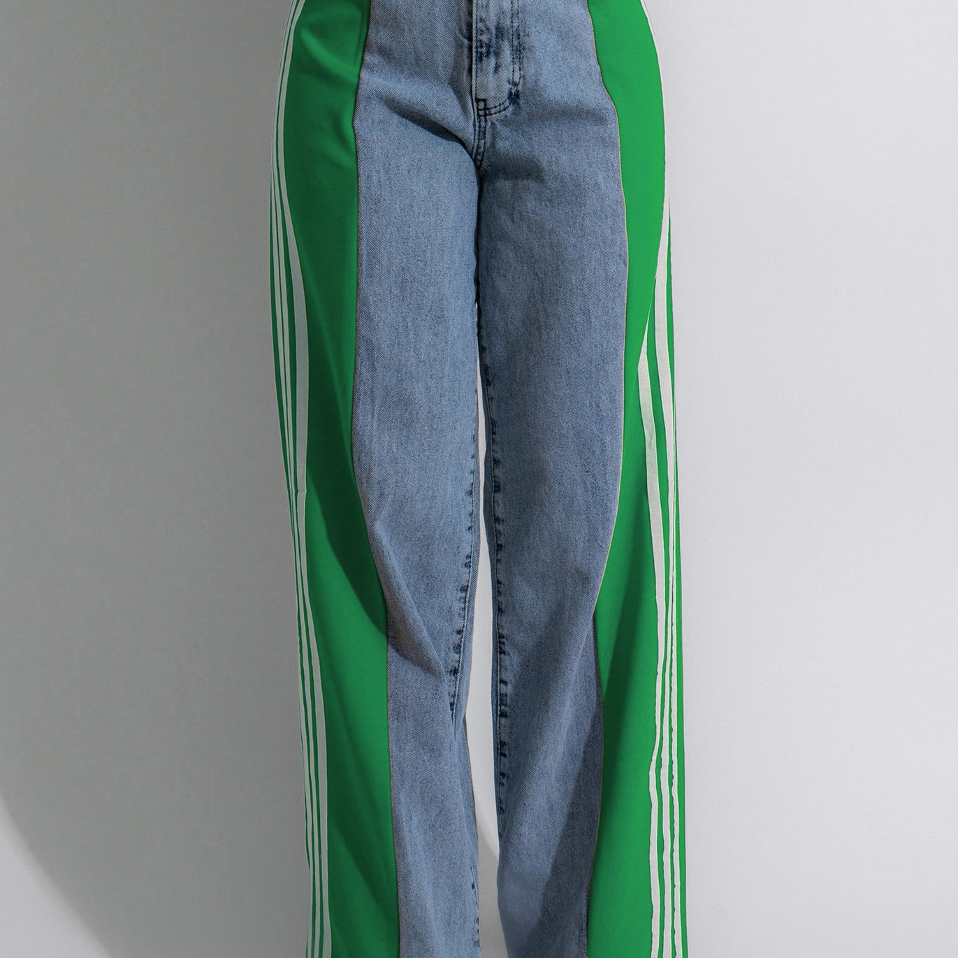 Wide-leg denim jeans with green side panels and white stripes in trendy fashion ملابس