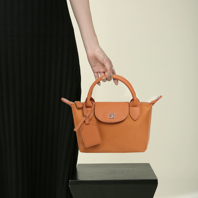 Orange leather handbag with top handle, perfect for fashion and ملابس by Langry