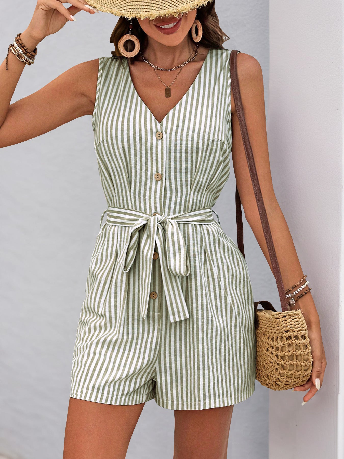 Sleeveless green and white striped romper with v-neck and waist tie for summer fashion
