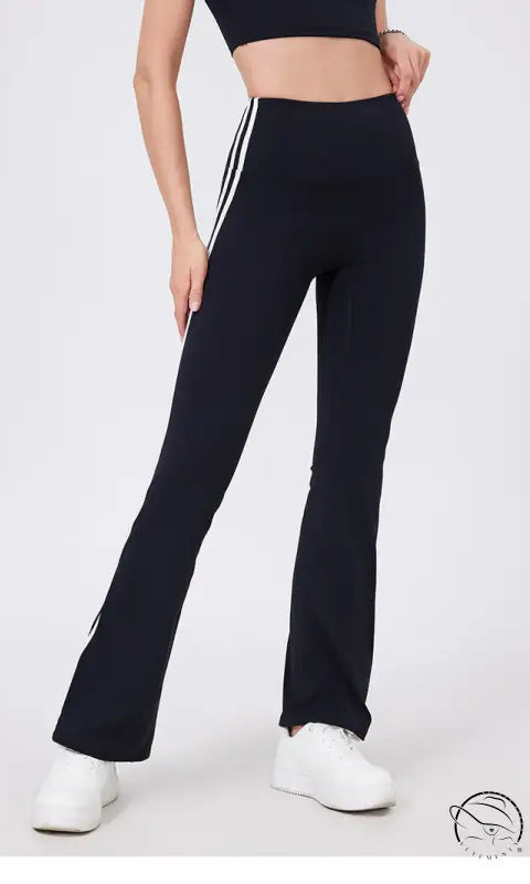 Black high-waist yoga pants with white stripes and peach hip raise