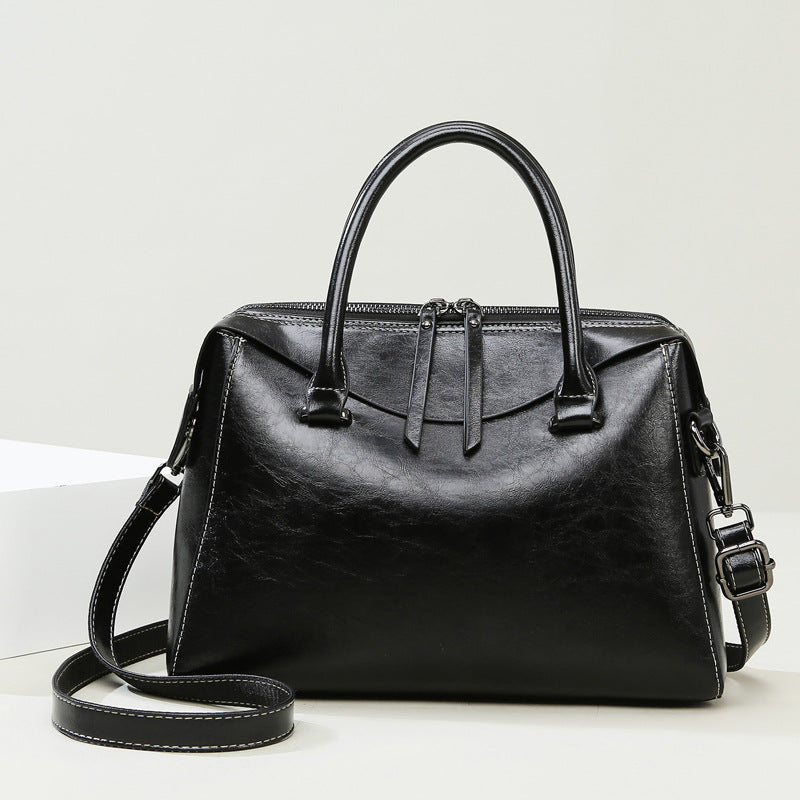 Elegant langry black leather fashion handbag with structured design