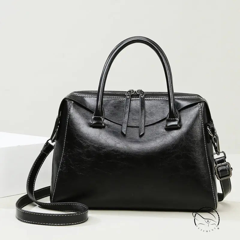 Elegant langry fashion black leather handbag with structured design