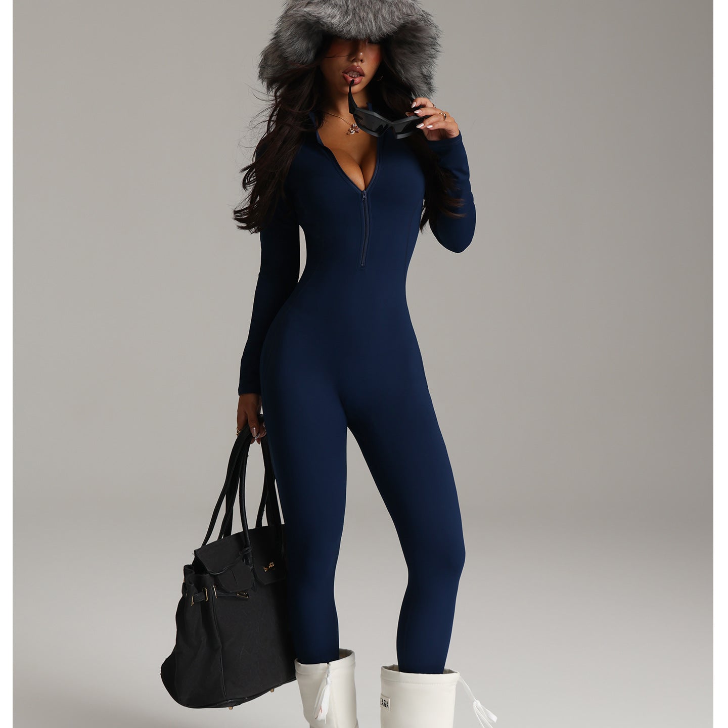 Navy blue langry fashion jumpsuit with fur hood and white boots