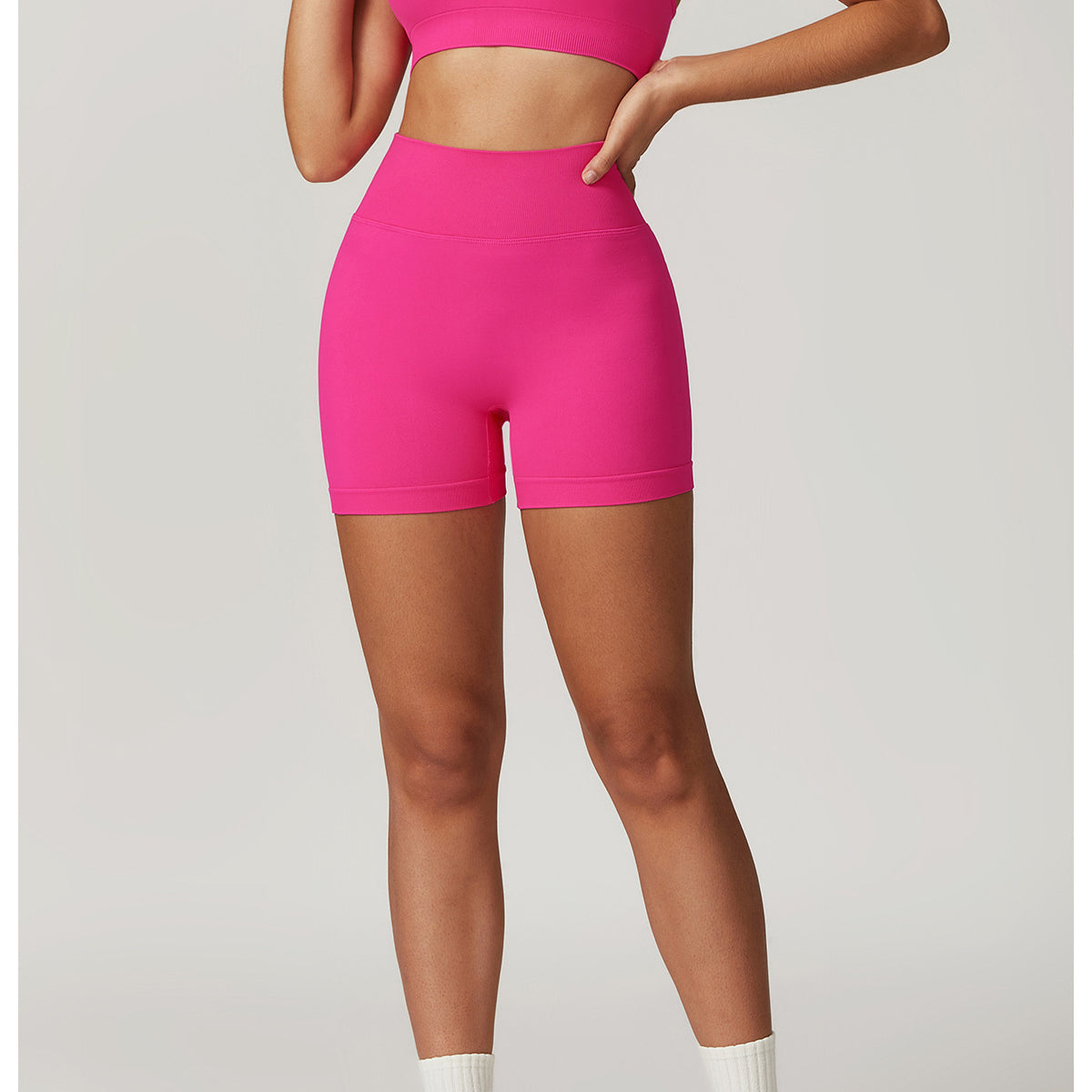 Pink Seamless Yoga Suit featuring athletic shorts and top for optimal performance