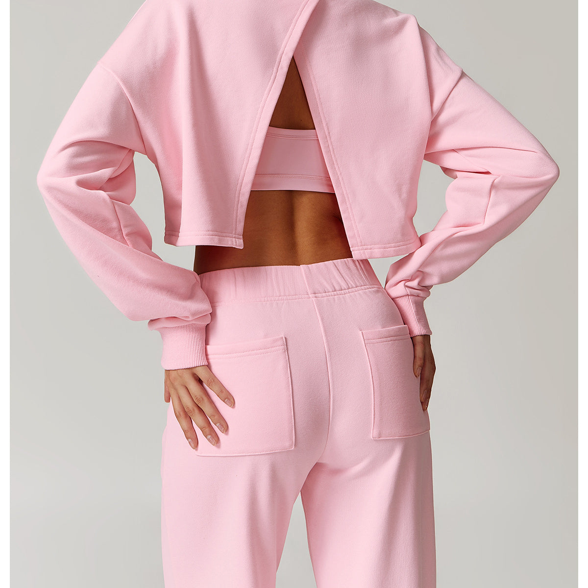 Pink long sleeve athletic wear set, ideal for fashion-forward sports and workouts