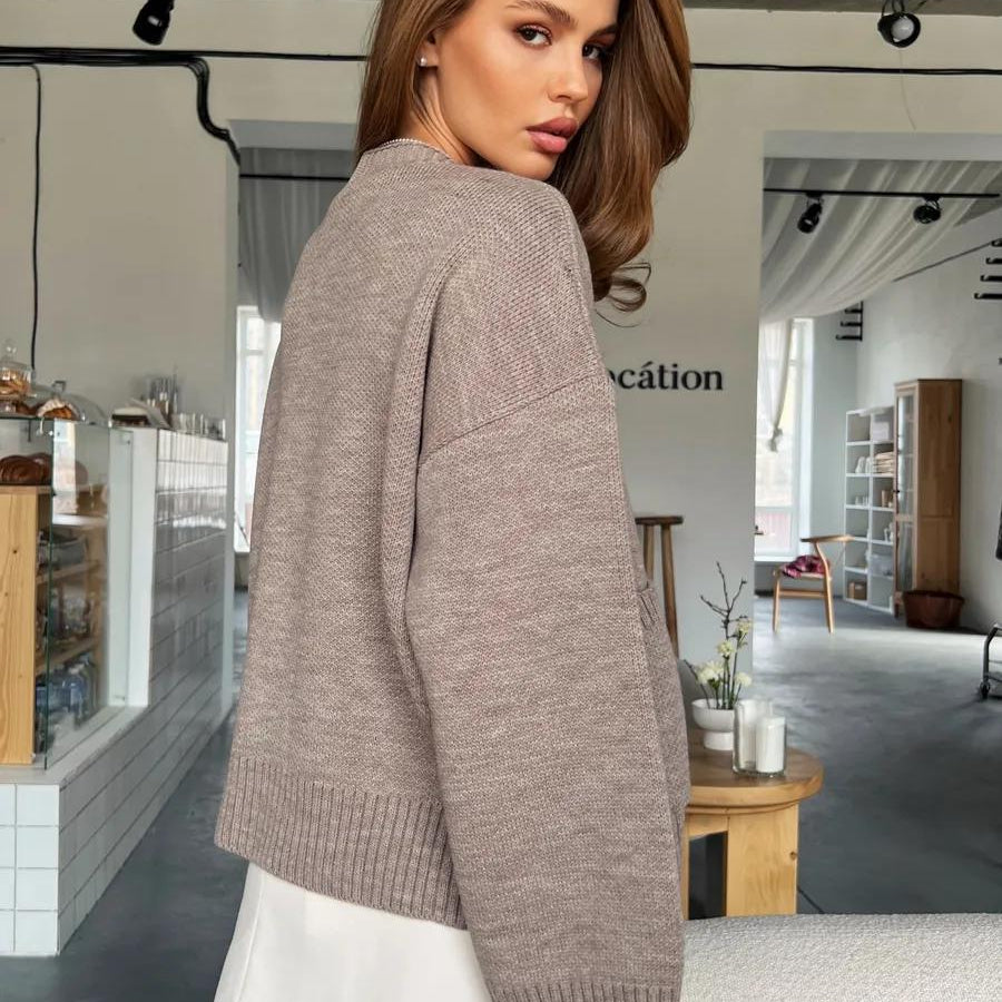 Beige oversized knitted cardigan sweater coat with soft design