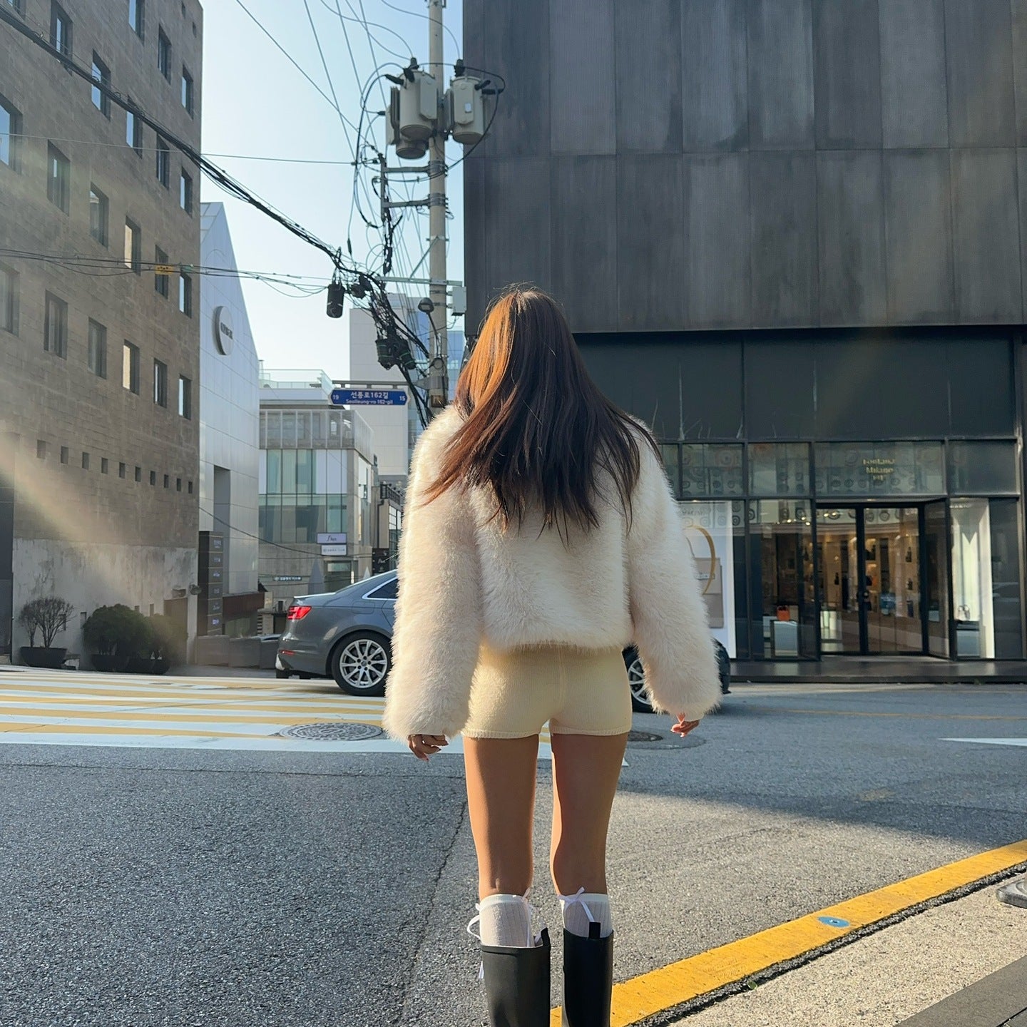 Langry faux fur oversized coat with rubber boots and socks