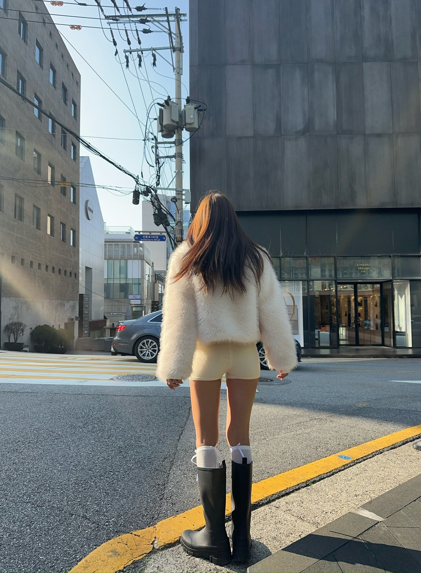 Langry faux fur oversized coat with rubber boots and socks