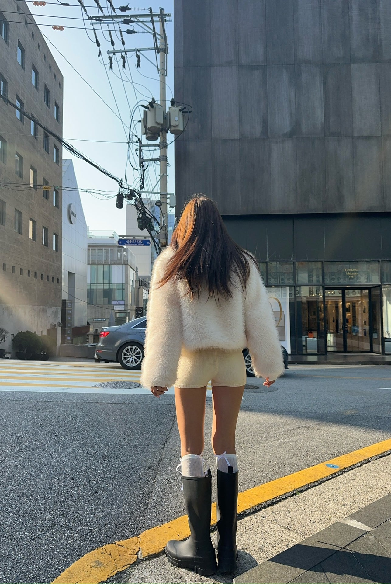 Langry faux fur oversized coat with rubber boots and socks