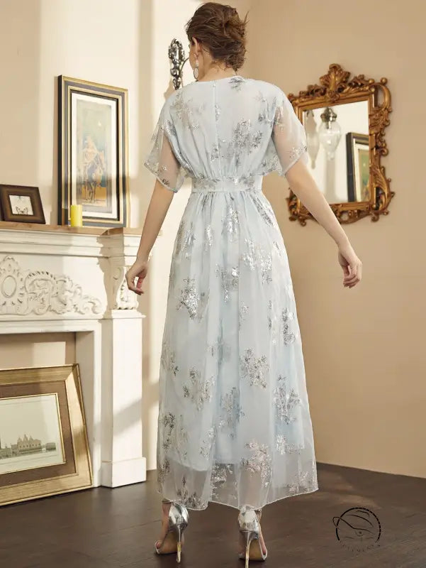 Elegant light blue semi-sheer maxi dress with silver floral embroidery