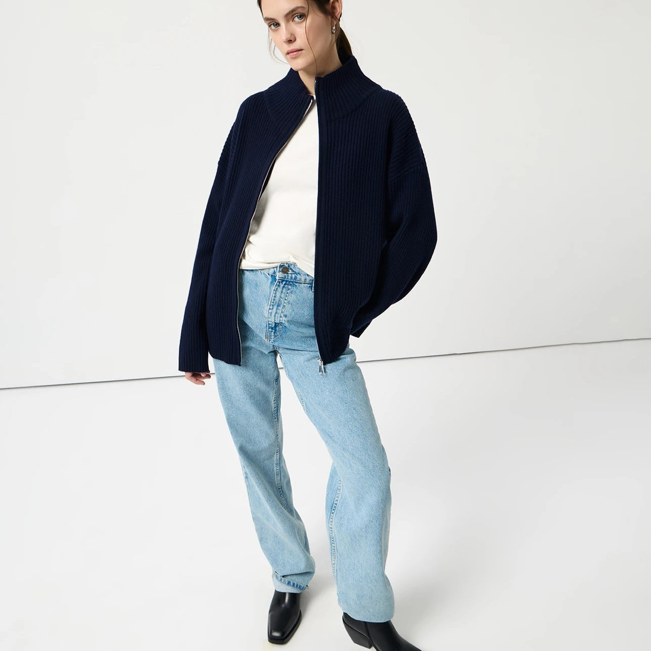 Navy blue langry cozy wool zip-up cardigan with regular sleeve, light wash jeans, black boots