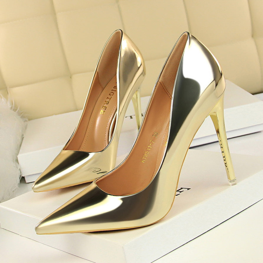 Pair of gold stiletto heels from Langry for a fashionable look in ملابس