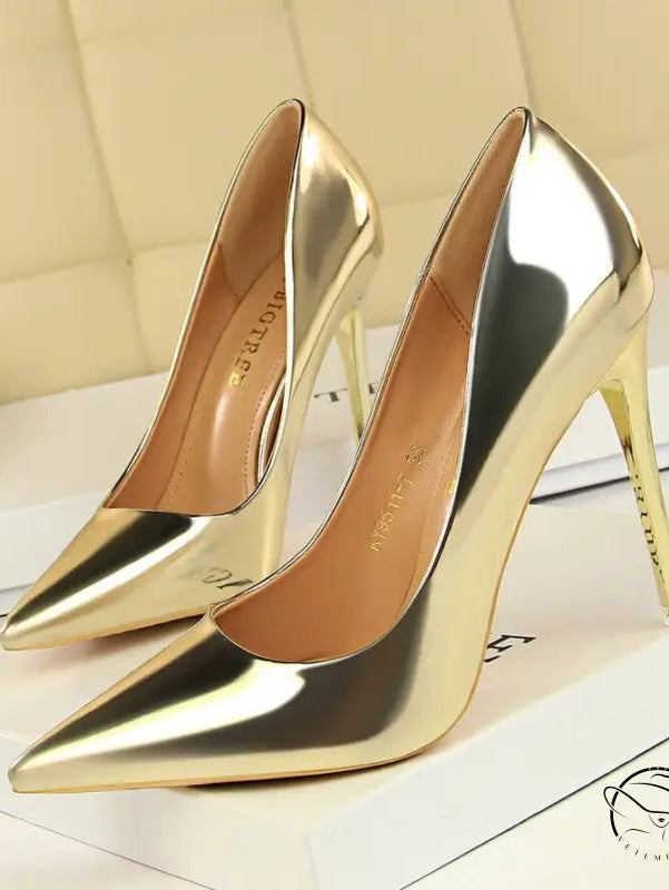 Pair of fashionable gold stiletto heels in langry style