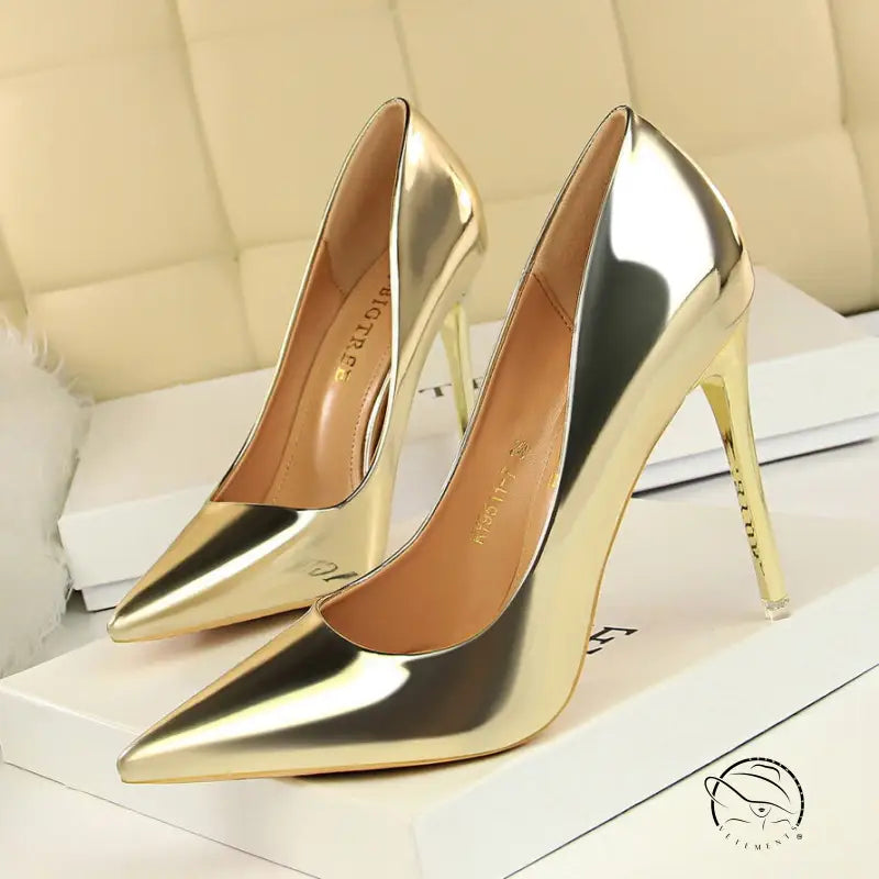 Pair of fashionable gold stiletto heels in langry style