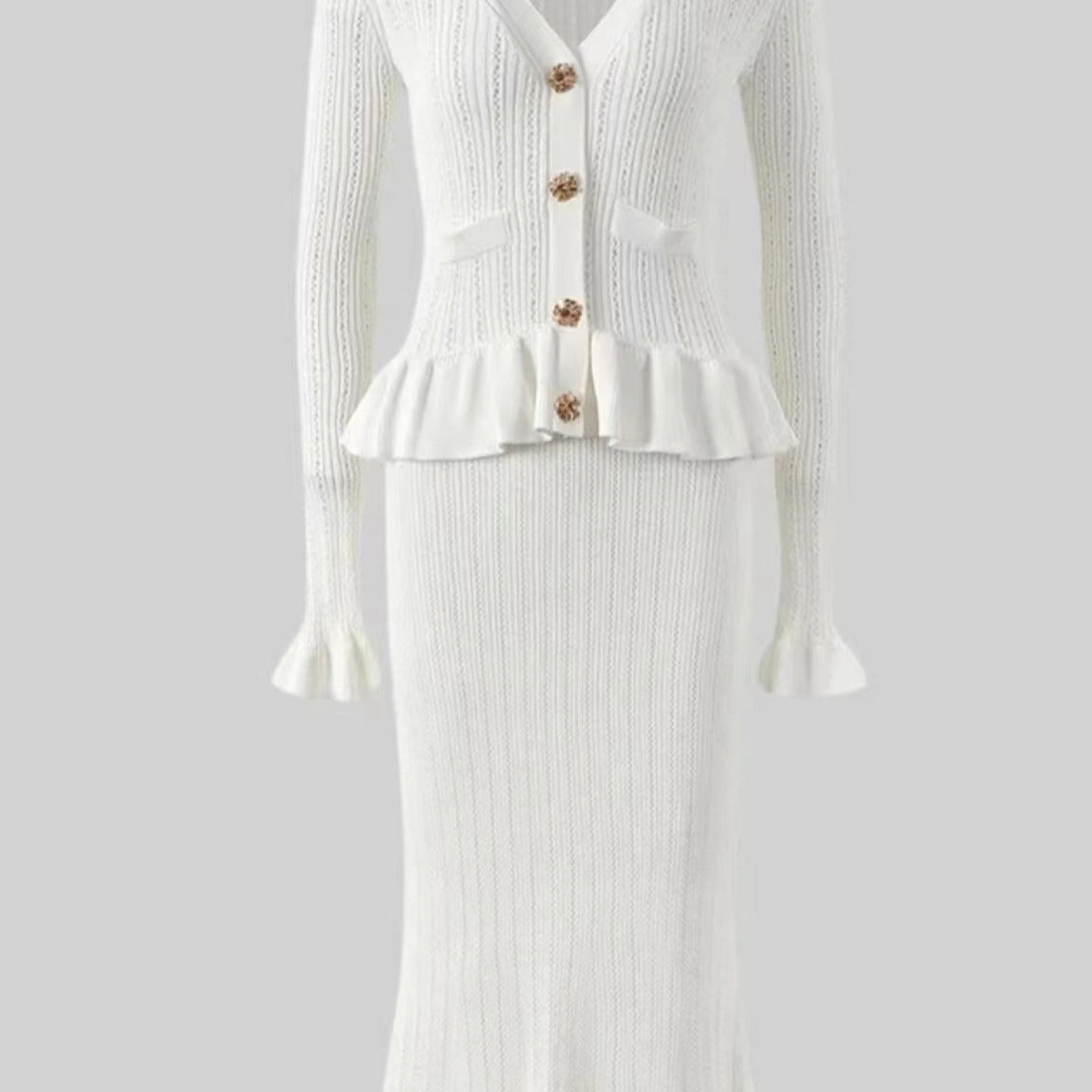 Elegant white ribbed knit dress and skirt set showcasing timeless fashion style