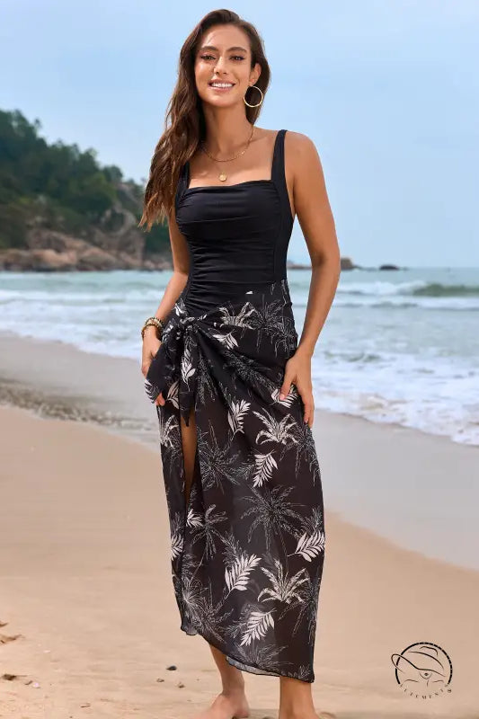 Black and white floral one piece swimsuit with tropical sarong