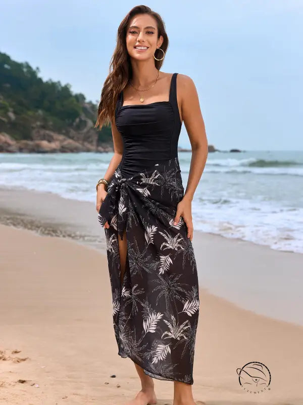 Black and white floral one piece swimsuit with tropical sarong