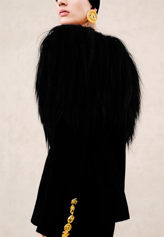 Langry elegant business blazer in black fur with gold trim and oversized yellow earrings, fashion ملابس