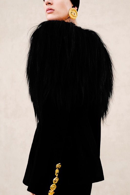 Langry elegant business blazer in black fur with gold trim and oversized yellow earrings, fashion ملابس
