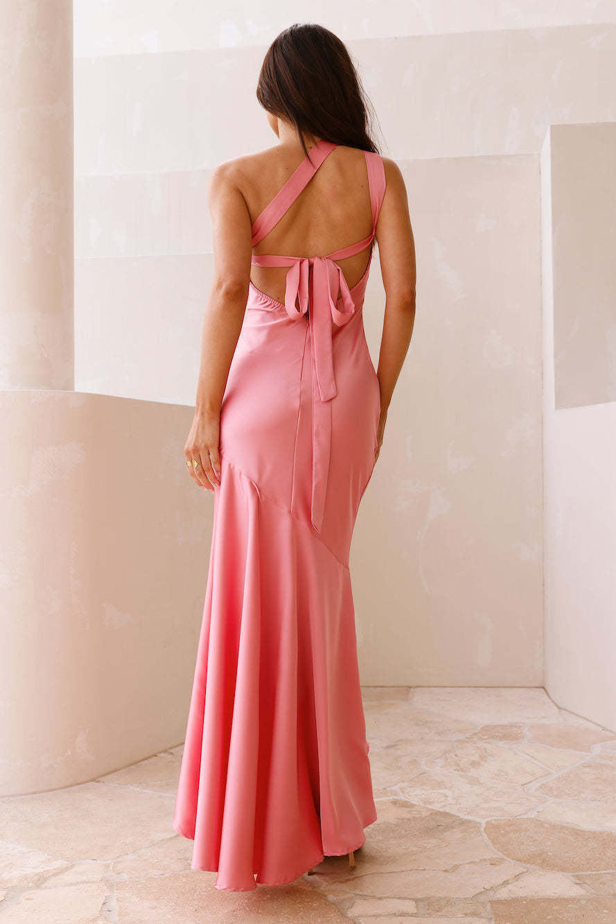 Sleek coral pink fishtail dress with tie-back halter design and mermaid silhouette