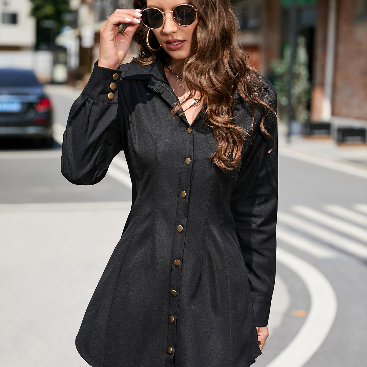 Black button-down shirt dress, a stylish long sleeve fashion piece for modern elegance