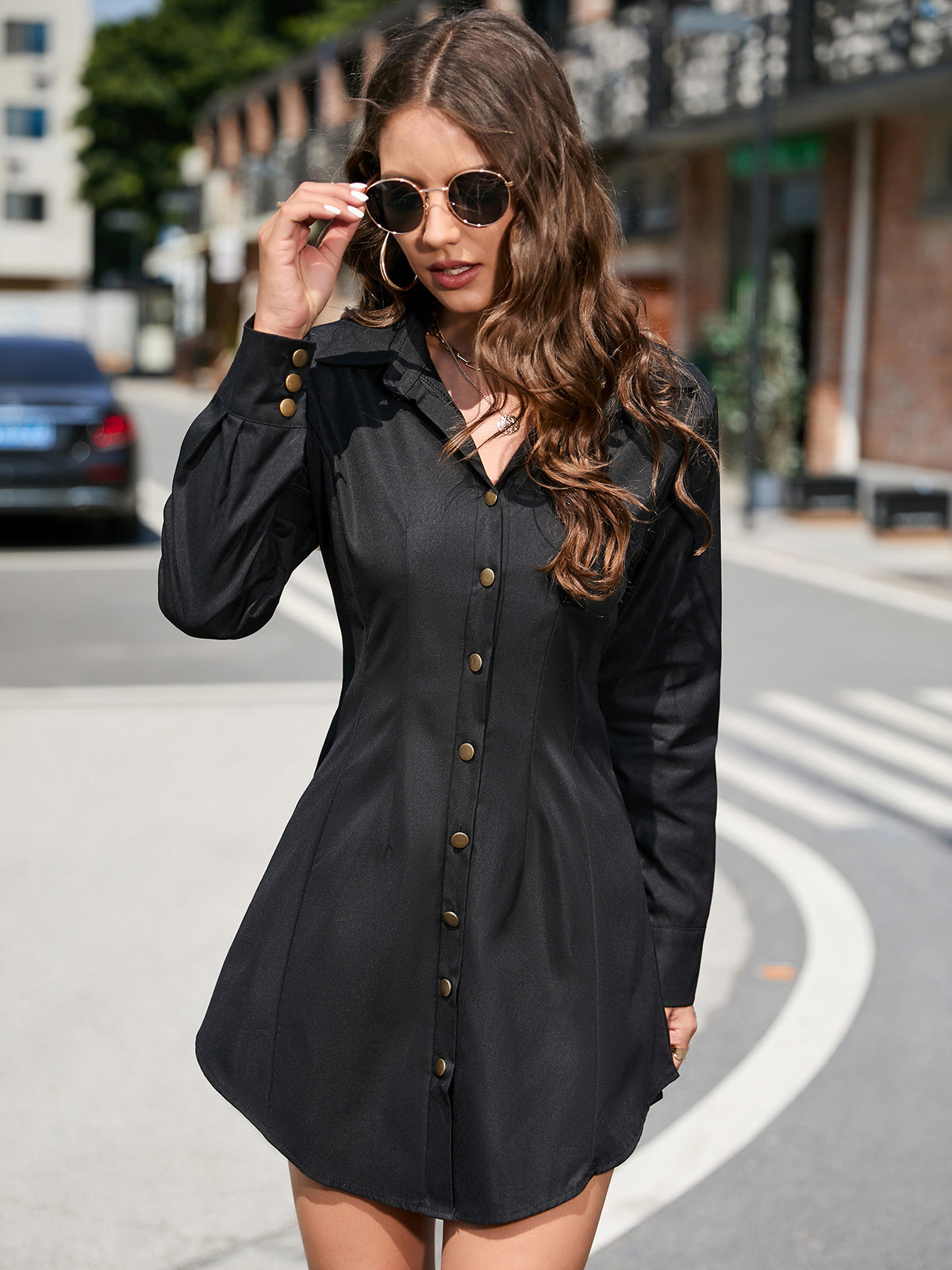 Black button-down shirt dress, a stylish long sleeve fashion piece for modern elegance