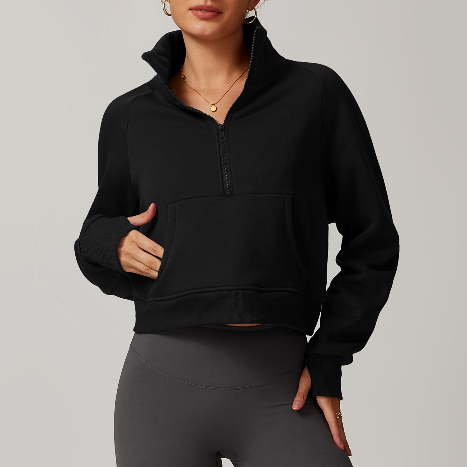 Black half-zip cropped sweatshirt with mock turtleneck collar, a stylish Winter Fleece option