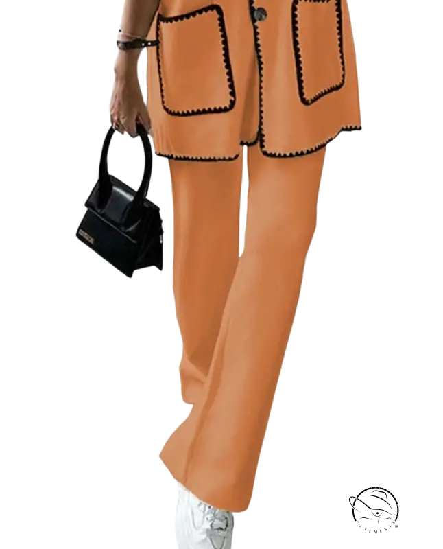 Orange suit with black scalloped trim, blazer and leather handbag set