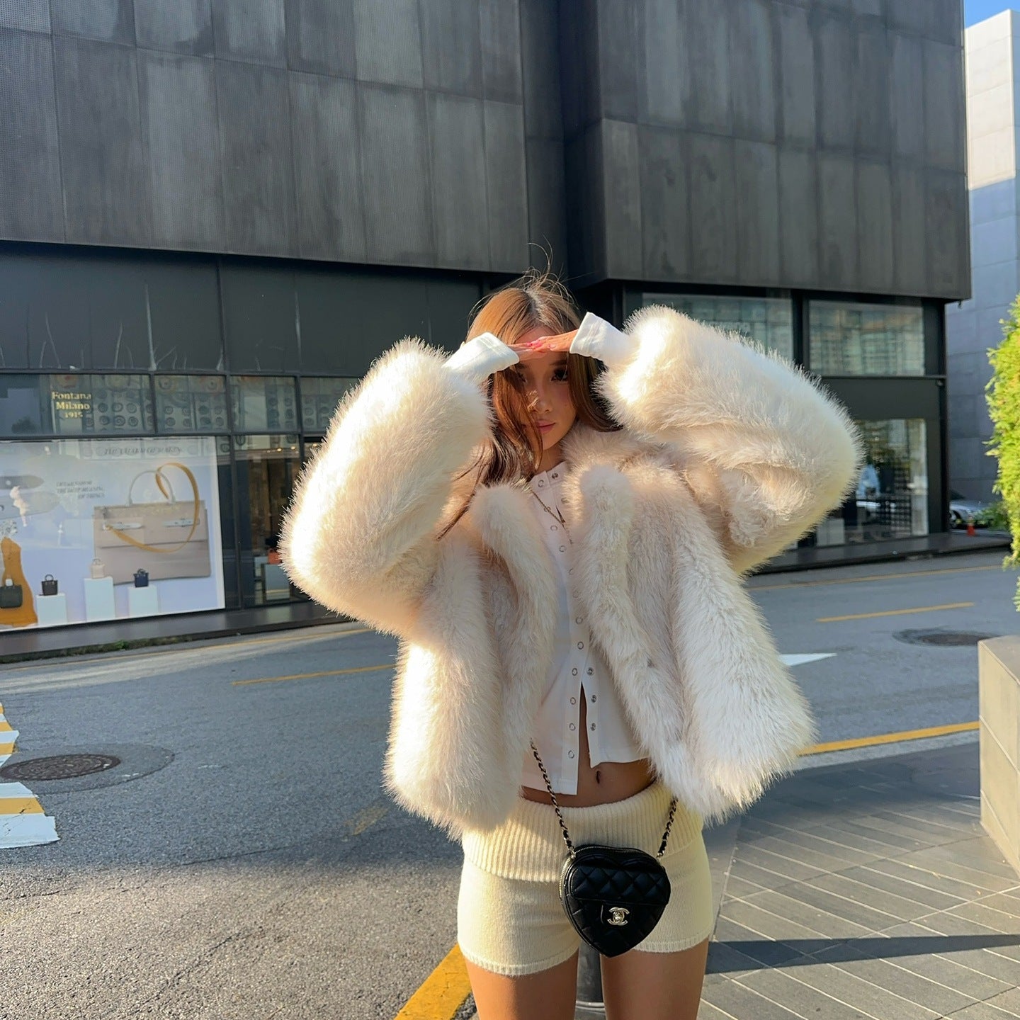 Cream fluffy faux fur jacket with cropped fit and oversized sleeves